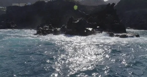 4k drone shot of oceanic powerful waves hitting rocks Stock Footage 83872399