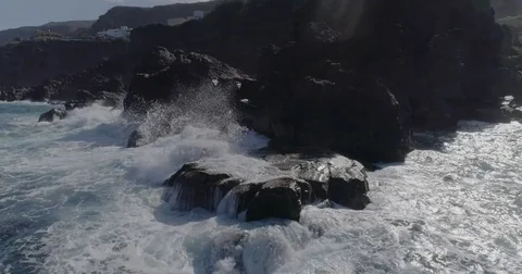 4k drone shot of oceanic powerful waves hitting rocks Stock Footage 83872439
