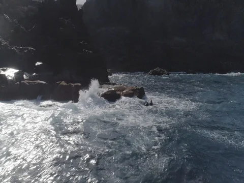 4k drone shot of oceanic powerful waves hitting rocks Stock Footage 83872662