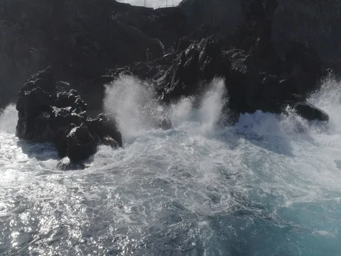 4k drone shot of oceanic powerful waves hitting rocks Stock Footage 83872691