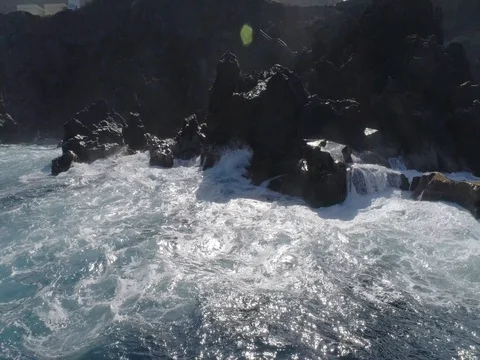 4k drone shot of oceanic powerful waves hitting rocks on the ocean Stock Footage 83872730