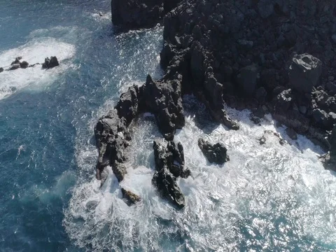 4k drone shot of oceanic powerful waves hitting rocks Stock Footage 83872839