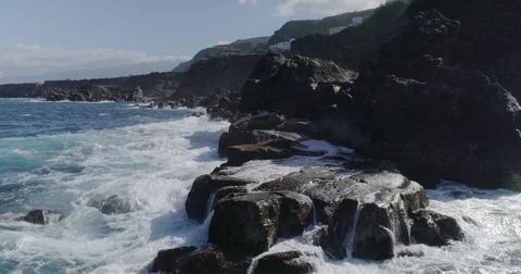 4k drone shot of oceanic powerful waves hitting rocks Stock Footage 83872855