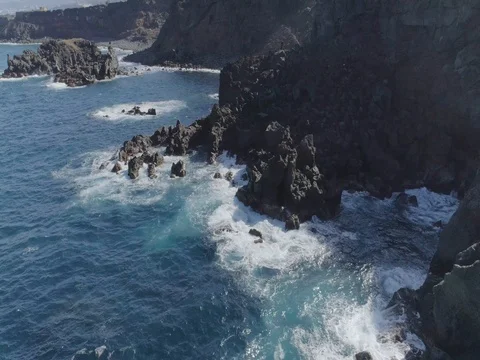 4k drone shot of oceanic powerful waves hitting rocks Stock Footage 83872868