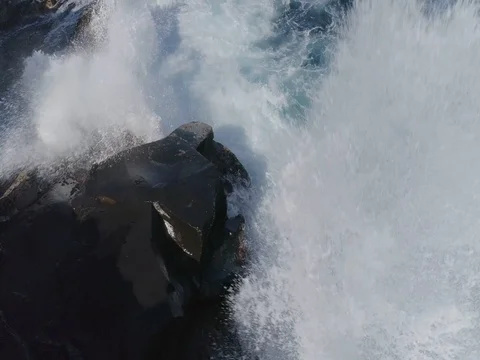 4k drone shot of oceanic powerful waves hitting rocks Stock Footage 83872901