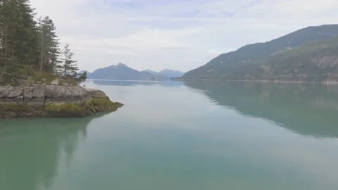 4K Drone Shot over crisp blue mountain lake Stock Footage 149514533
