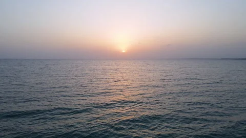 4k drone shot of sunset over the sea Video stock 260812406