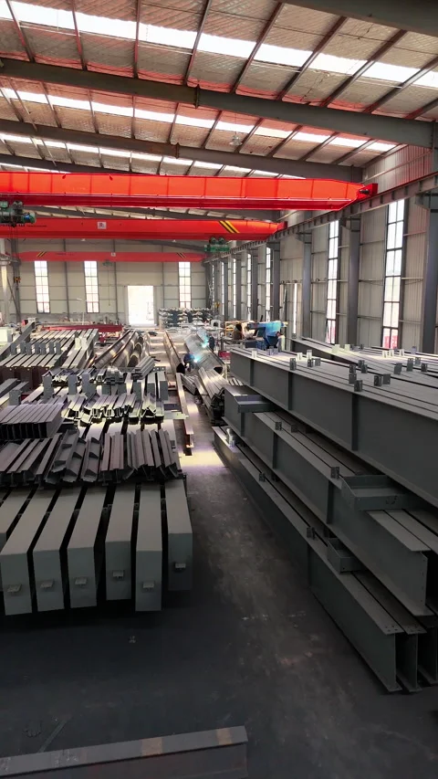 4K Drone Shot of Two Welders Working on Steel Beam in Metal Fabrication  Stock Footage 335793429