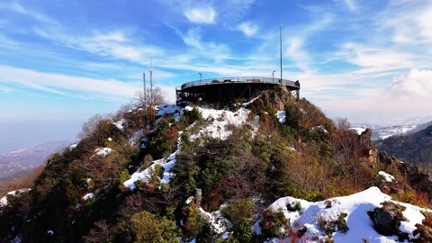 4K Drone Slow Push Toward Snowy Mountain Observation Terrace Video stock 334921493
