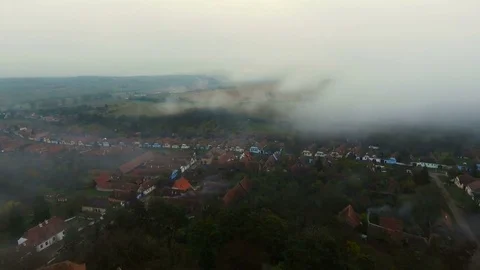 4k drone slow shot over medieval church and saxon houses in Viscri village. Stock Footage 78225523