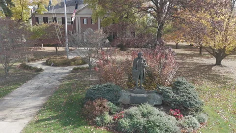 4k drone small town statue in front of government building Stock Footage 289785524