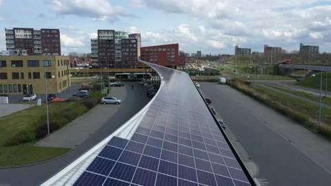 4K drone solar panels parking place tilt down Stock Footage 171210417
