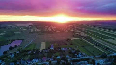 4K Drone Sunset Over Rural Moldovan Village and Lake Stock Footage 321825516