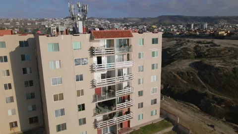 4K DRONE Tilt Up on Apartment Complex in Tijuana, 60fps Stock Footage 219664688