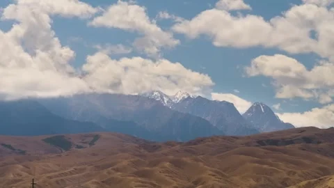 4K drone time lapse of clouds moving on high mountains of Kyrgyzstan Stock Footage 306568932