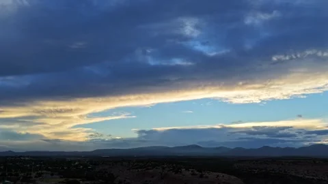 4K Drone Timelapse: Blue And Gold Sunset Clouds Over Desert Mesas Stock Footage 339044571
