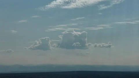 4K Drone Timelapse Of Clouds Shifting Over Blue Hazy Mountains Stock Footage 344097154