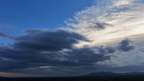4K Drone Timelapse of Dark Clouds Overcoming Light Evening Sky Stock Footage 347935231