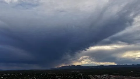 4K Drone Timelapse Of Dark Storm Clearing At Glowing Sunset Stock Footage 344311405