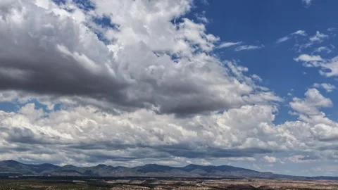 4K Drone Timelapse Of Fast Moving Stormy Clouds Over Vast High Desert Stock Footage 340928633