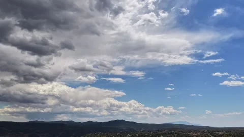 4K Drone Timelapse of Receding Storm Clouds and Dynamic Movement Over a Desert Stock Footage 335921102
