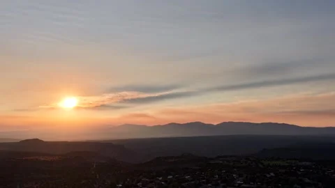 4K Drone Timelapse Of Rising Sun Casting Long Dark Beam Through Wildfire Smoke Stock Footage 340266920