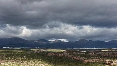 4K Drone Timelapse of Rolling Storm Clouds and Shifting Light Waves over Stock Footage 334662423