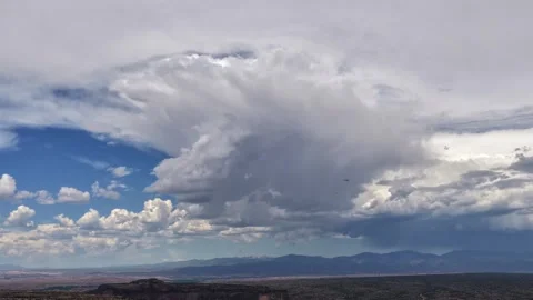 4K Drone Timelapse: Stunning Cloud Silhouetted By Morphing Layer In Desert Stock Footage 338166759