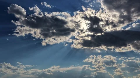 4K Drone Timelapse Of Sun Rays Beaming Behind Fast Moving Clouds Stock Footage 340337921