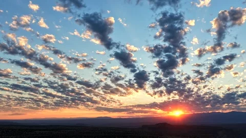 4K Drone Timelapse Of Sunrise Light Rays And Cloud Rows Over Canyon Stock Footage 340928992