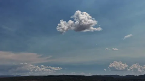 4K Drone Timelapse Of Zen Single Morphing Cloud Over Southwest Landscape Stock Footage 340328908