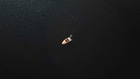 4K DRONE TOP DOWN FOLLOW SPEEDBOAT WITH LENS FLARES Video stock 110536472