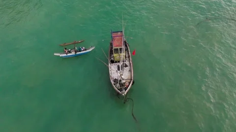 4K Drone Top Down Orbit of Fishing Boat at Weligama Port in Morning Light Stock Footage 318548860