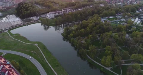 4k drone top view flight over park and pond. Straight down view from flying Stock Footage 153394603