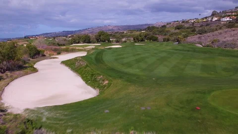4K drone tracing Hole 16 at Trump National LA golf course Stock Footage 89643282