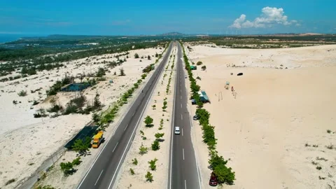 4K Drone Tracking Shot of Car Driving through White Sand Dunes Video stock 330037710