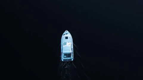 4K Drone Tracking Single Boat Over Water at Dusk in Carrick-on-Shannon Stock Footage 301577890