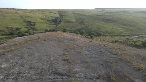 4K Drone Tracking Towards Historic Slag Heap at Waterside Ironworks, Dalmellingt Stock Footage 340021507