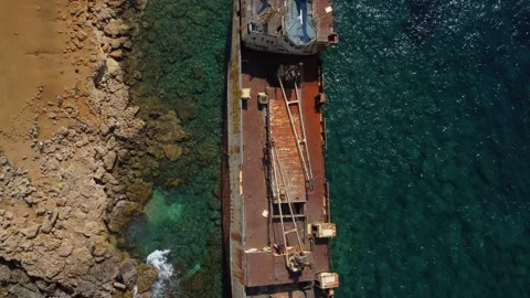 4K drone video, abandoned ship, blue crystal sea, rocky beach, Cyprus Stock Footage 237358927