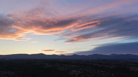 4K Drone Video of Colorful Clouds and Moving Light over Desert Mountains and Stock Footage 335157076