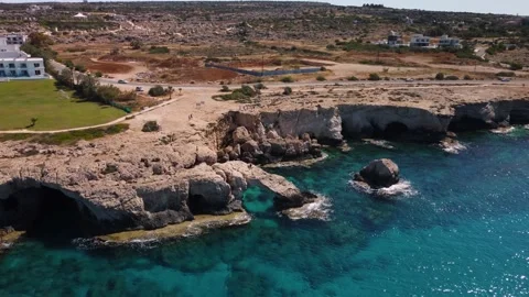 4K drone video of the crystal clear sea and rocky cliffs Stock Footage 237343400