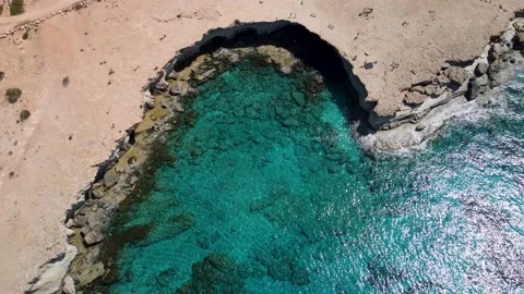 4K drone video crystal clear sea, rocky beach, cliffs, caves, Ayia Napa, Cyprus Stock Footage 237346196