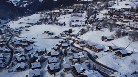 4K Drone Video: Following a Train Through Winter Grindelwald, Switzerland Stock Footage 246608961