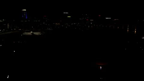 4K Drone video glowing hot air balloons in downtown Wichita Kansas sunset dusk Stock Footage 170444885