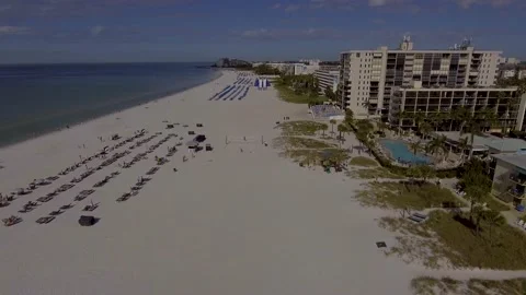 4K Drone Video (High Speed Flyover) of Beach Cabanas, Umbrellas, and Video stock 231955692
