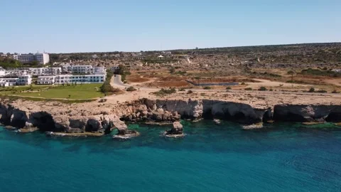 4K drone video of rocky cliffs and crystal clear sea water Stock Footage 237343352