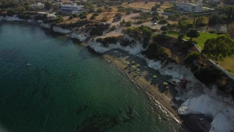 4K drone video of a sandy beach with crystal clear water at sunset Stock Footage 237341847