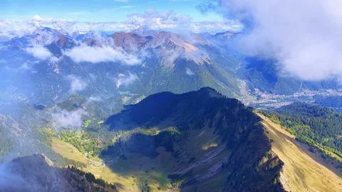 4K Drone View Alpine Mountains With Clouds And Misty Valley Fotos de archivo