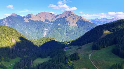4K Drone View Alpine Valley And Mountains In Summer Landscape Fotos de archivo