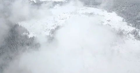 4K Drone view in cloudy and snowy mountains2 Stock Footage 125765502